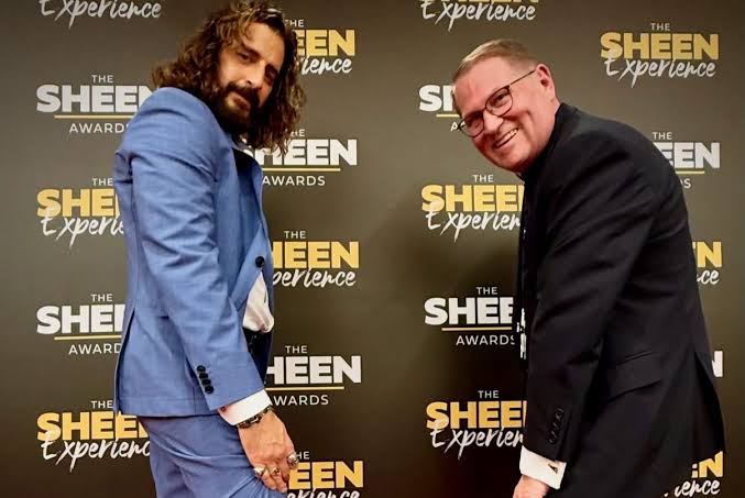 Jonathan Roumie at the Sheen Awards with another guest